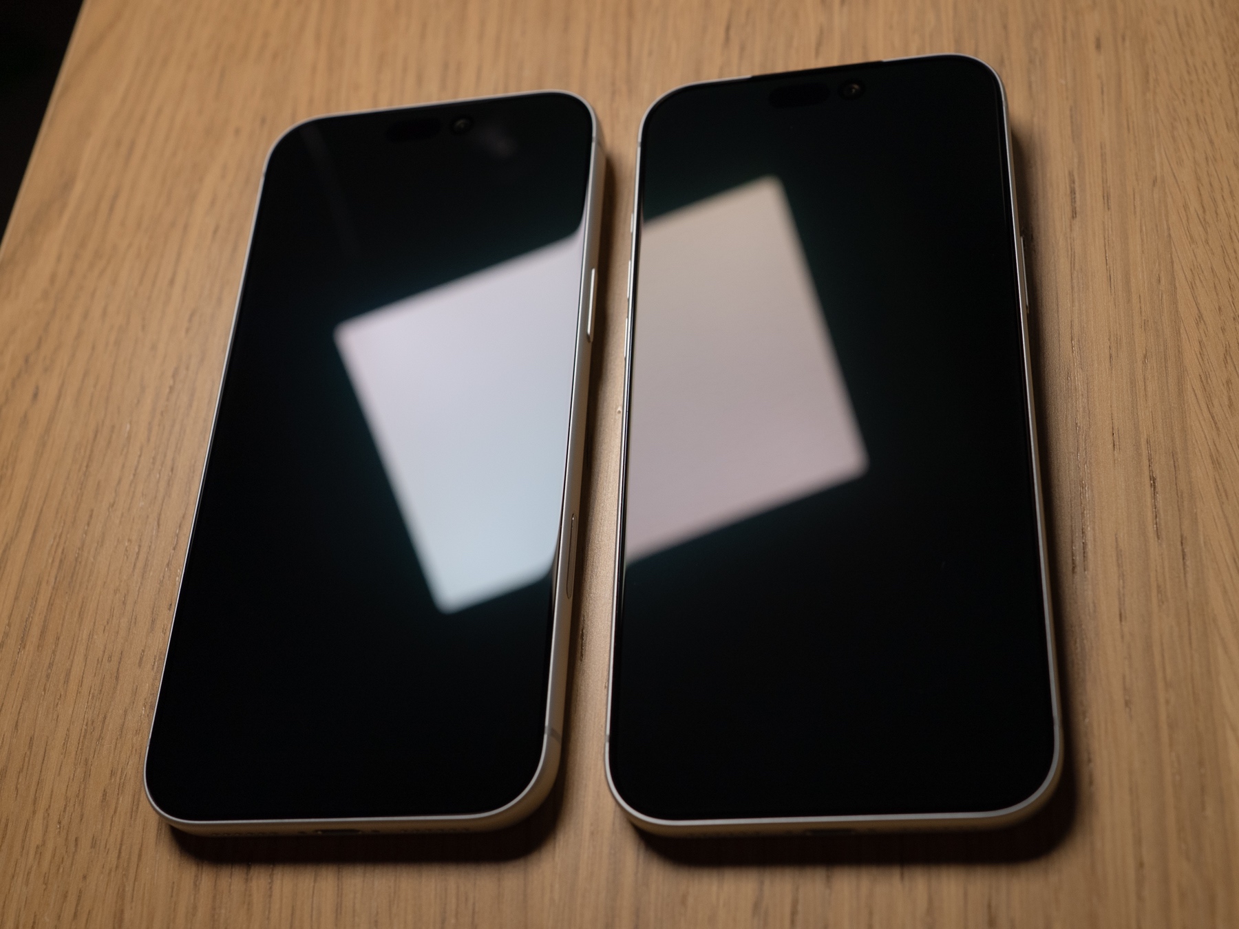 The bare screen on the left reflects more light than the premium screen protector on the right